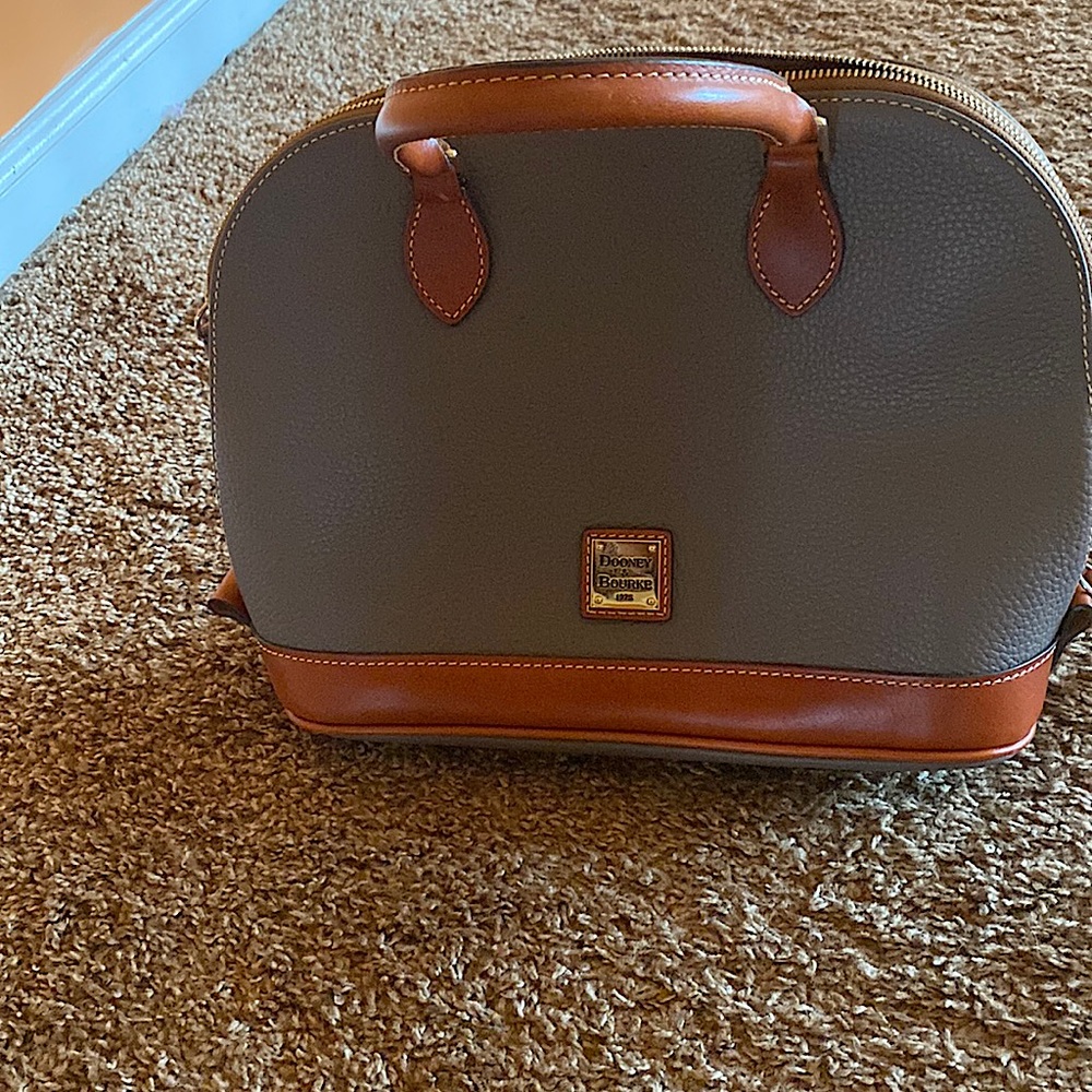 Dooney and Bourke  never used